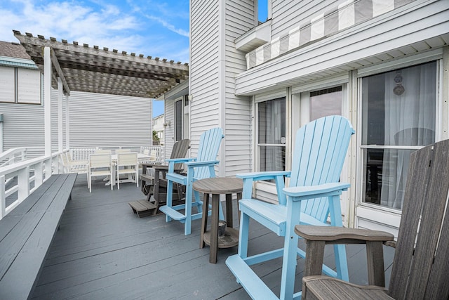 wooden terrace featuring a pergola and outdoor dining area