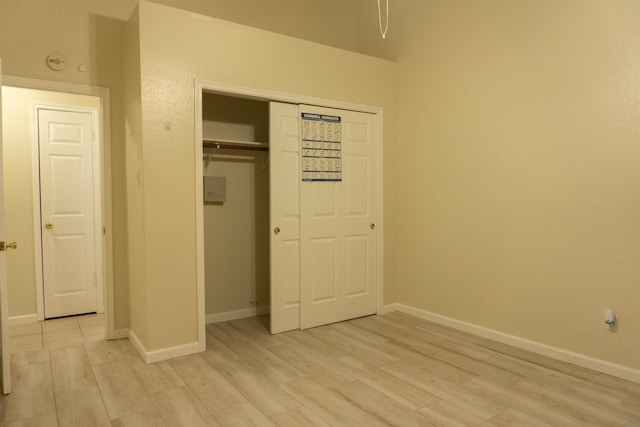 1527 Carbonear Dr, Channelview, TX 77530 - unfurnished bedroom with a closet, light wood finished floors, and baseboards