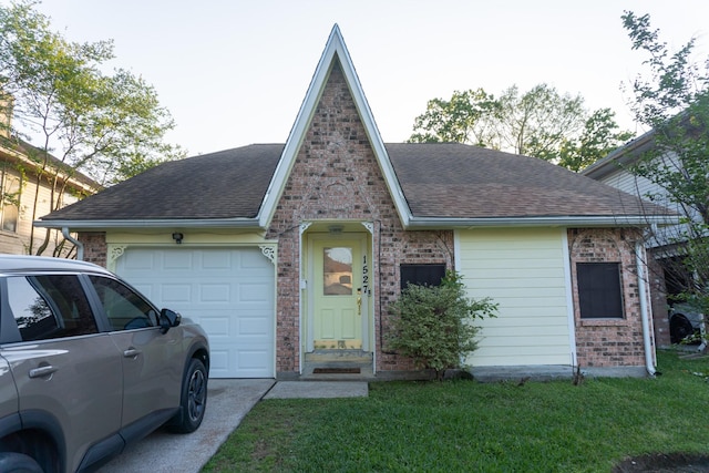 1527 Carbonear Dr, Channelview, TX 77530 - view of front of property featuring concrete driveway, roof with shingles, brick siding, a front lawn, and a garage