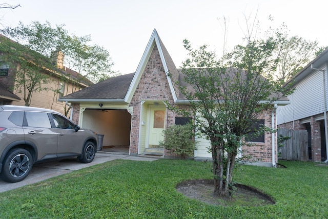 1527 Carbonear Dr, Channelview, TX 77530 - exterior space with a lawn, driveway, an attached garage, and brick siding
