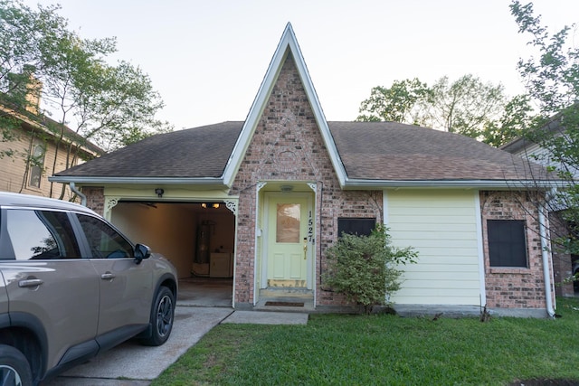 1527 Carbonear Dr, Channelview, TX 77530 - view of front of property featuring driveway, a shingled roof, an attached garage, and brick siding