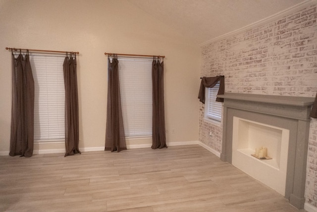 1527 Carbonear Dr, Channelview, TX 77530 - unfurnished living room with light wood-style flooring, lofted ceiling, and baseboards