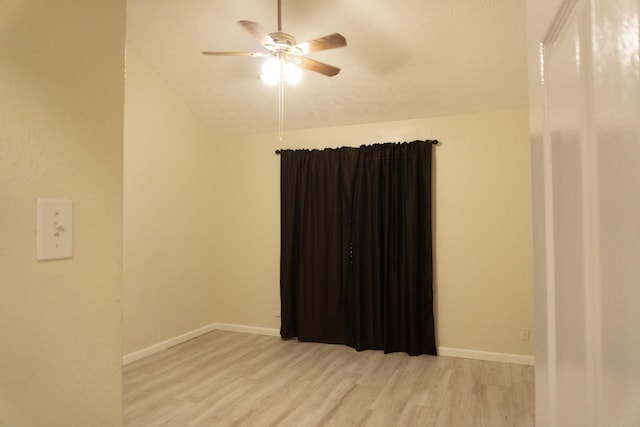 1527 Carbonear Dr, Channelview, TX 77530 - spare room featuring baseboards, ceiling fan, lofted ceiling, and light wood-style flooring