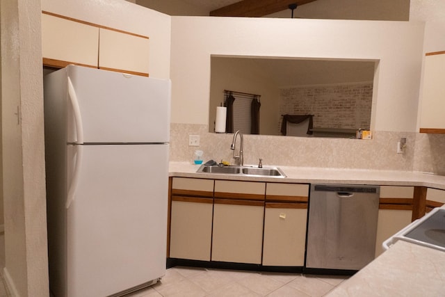 1527 Carbonear Dr, Channelview, TX 77530 - kitchen featuring a sink, tasteful backsplash, light countertops, dishwasher, and freestanding refrigerator