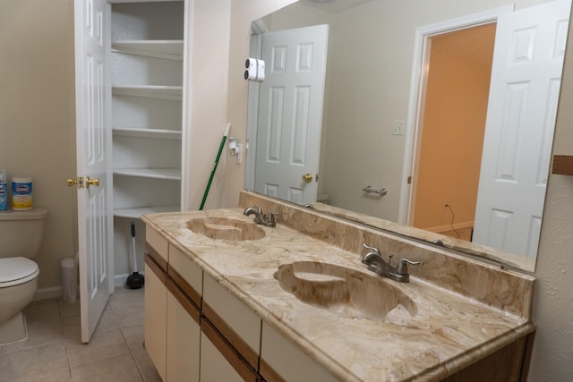 1527 Carbonear Dr, Channelview, TX 77530 - bathroom with tile patterned floors, toilet, double vanity, and a sink