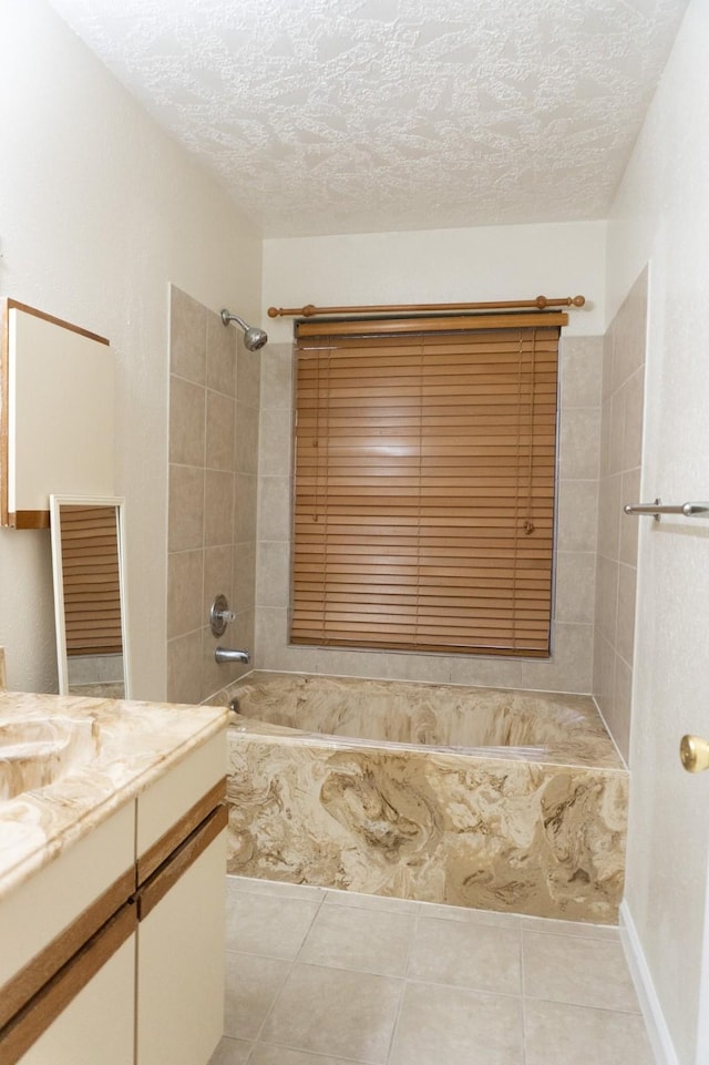 1527 Carbonear Dr, Channelview, TX 77530 - full bathroom with tile patterned floors, a textured ceiling, vanity, and  shower combination
