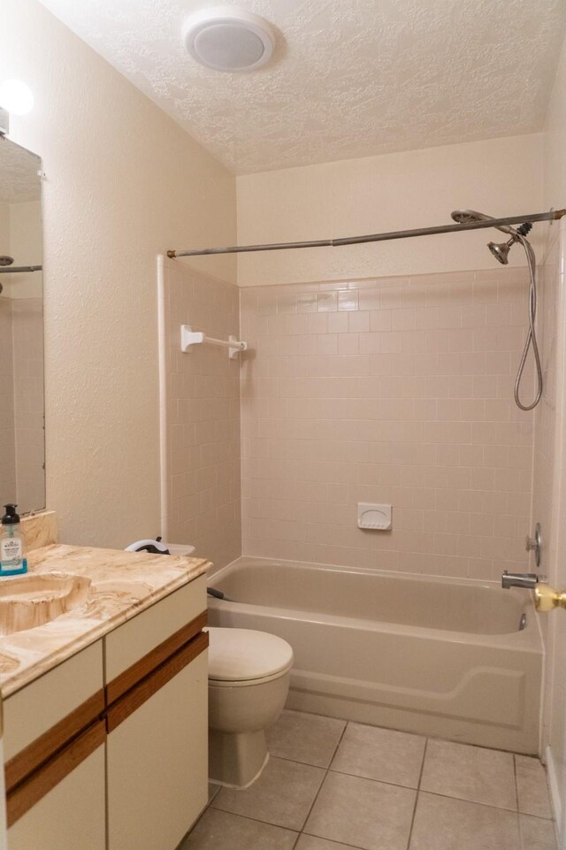1527 Carbonear Dr, Channelview, TX 77530 - full bath with tile patterned flooring, a textured ceiling, toilet, and shower / bathing tub combination