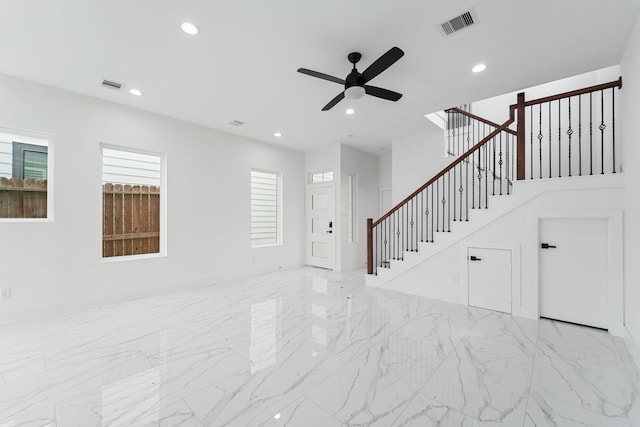 unfurnished living room featuring visible vents, a ceiling fan, stairway, and recessed lighting