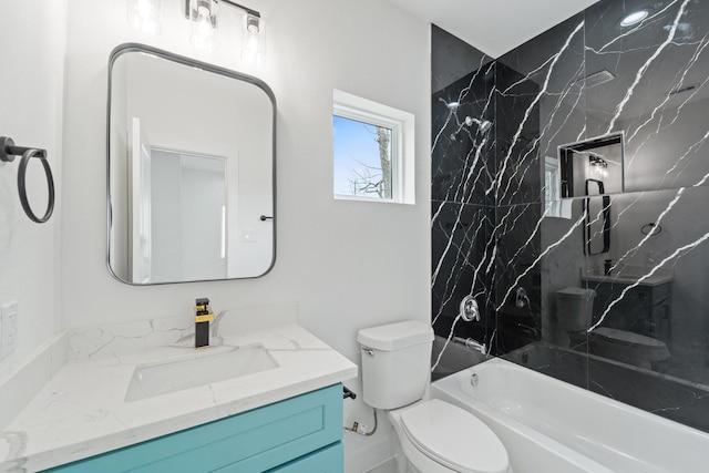 bathroom featuring shower / bathing tub combination, toilet, and vanity