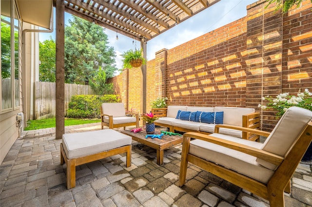 view of patio / terrace featuring an outdoor hangout area, a fenced backyard, and a pergola