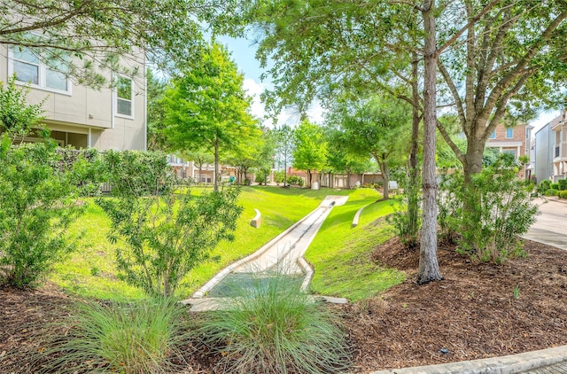 view of home's community featuring a lawn