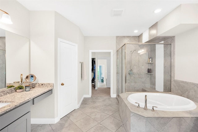 1705 Red Oak Point Dr, Houston, TX 77055 - bathroom featuring a stall shower, a bath, vanity, tile patterned floors, and baseboards