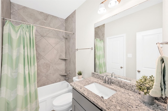 bathroom featuring shower / tub combo, vanity, and toilet