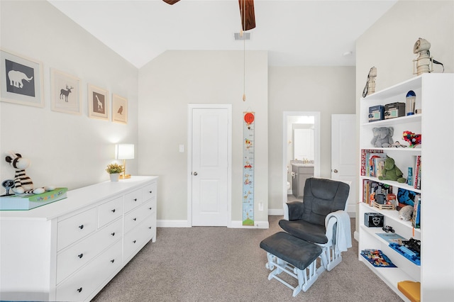 living area with a ceiling fan, visible vents, vaulted ceiling, baseboards, and light colored carpet