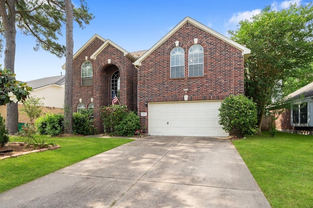 traditional-style home with concrete driveway, brick siding, and a front yard