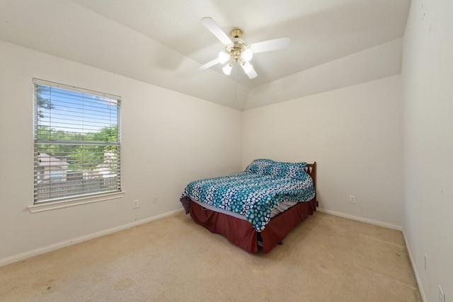 carpeted bedroom featuring baseboards and ceiling fan