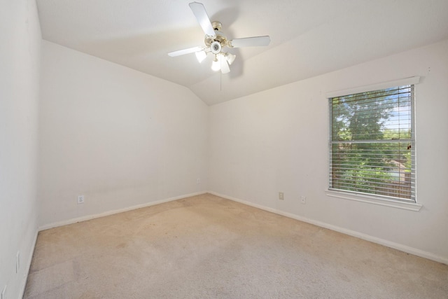 unfurnished room featuring baseboards, ceiling fan, carpet flooring, and lofted ceiling