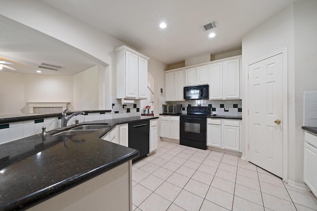 kitchen with light tile patterned flooring, a sink, white cabinetry, backsplash, and black appliances