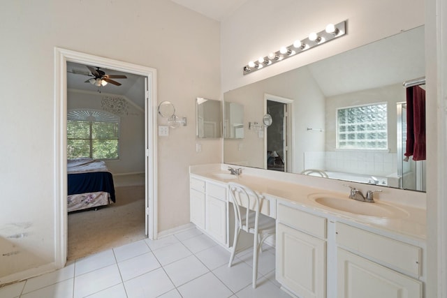 bathroom with a sink, a wealth of natural light, ensuite bath, and lofted ceiling