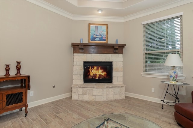 living room with crown molding, baseboards, and wood finished floors