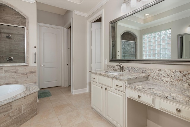 bathroom with vanity, ornamental molding, a bath, and a tile shower