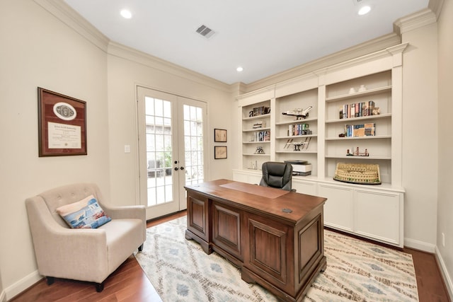 home office featuring crown molding, french doors, light wood-style flooring, baseboards, and visible vents