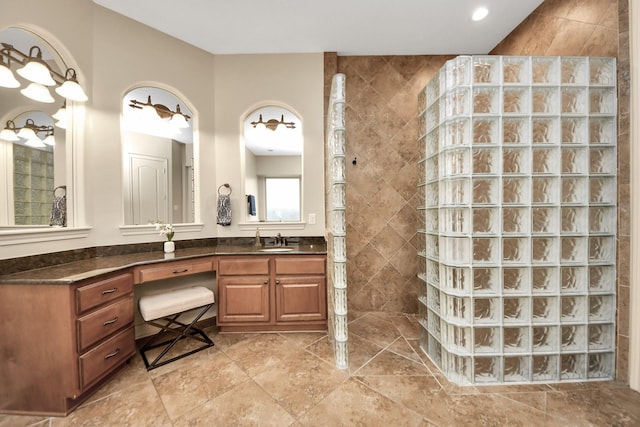 full bathroom featuring vanity and walk in shower