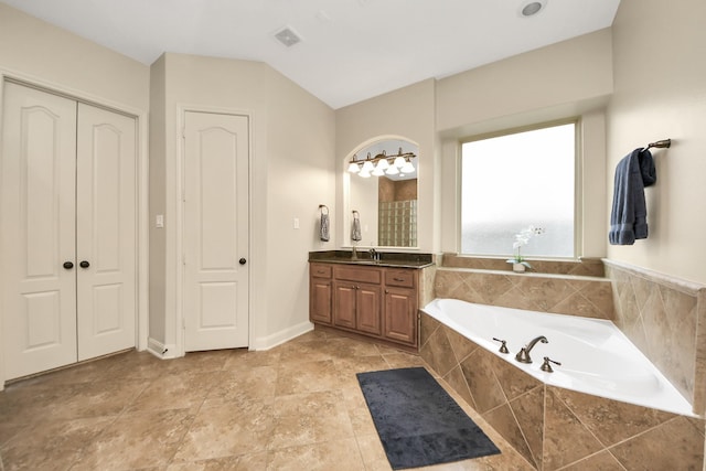 full bathroom with visible vents, a bath, and vanity