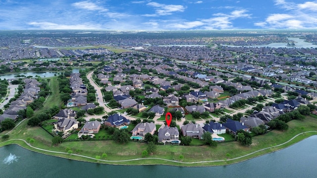 bird's eye view with a water view and a residential view
