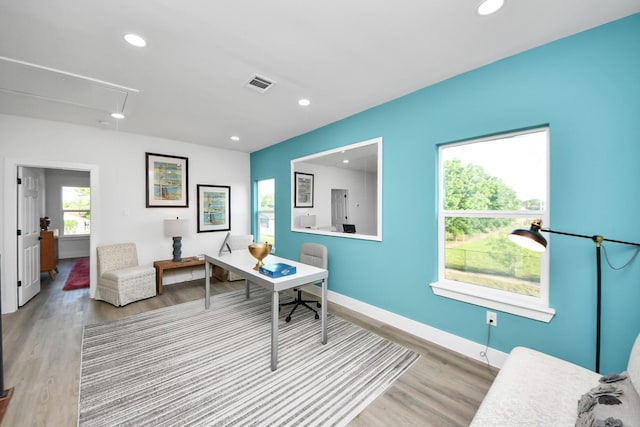 office space with attic access, visible vents, wood finished floors, and recessed lighting