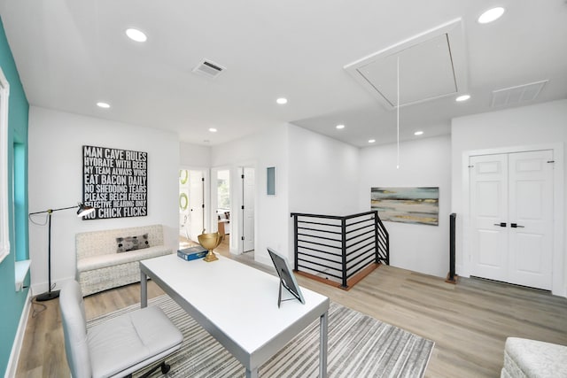 home office with visible vents, attic access, wood finished floors, and recessed lighting