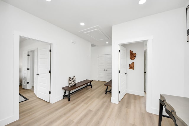 corridor with recessed lighting, attic access, light wood finished floors, baseboards, and visible vents