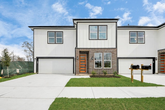 view of front of house with a front lawn, board and batten siding, brick siding, concrete driveway, and an attached garage