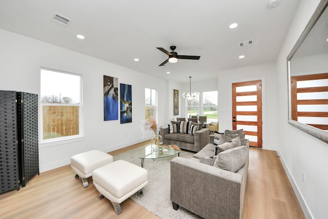 living room featuring visible vents, recessed lighting, and light wood-style floors