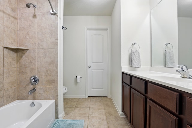 bathroom featuring shower / bathtub combination, baseboards, toilet, tile patterned floors, and vanity