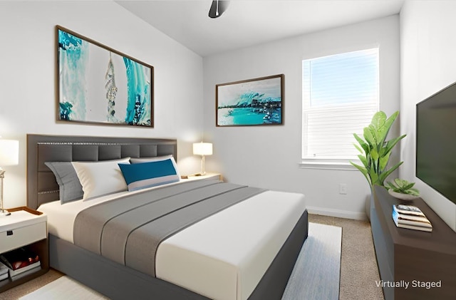 carpeted bedroom featuring baseboards