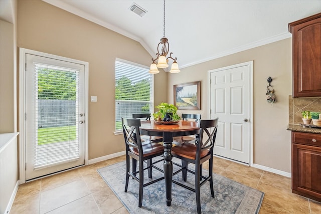 dining area featuring light tile patterned flooring, a notable chandelier, visible vents, vaulted ceiling, and ornamental molding