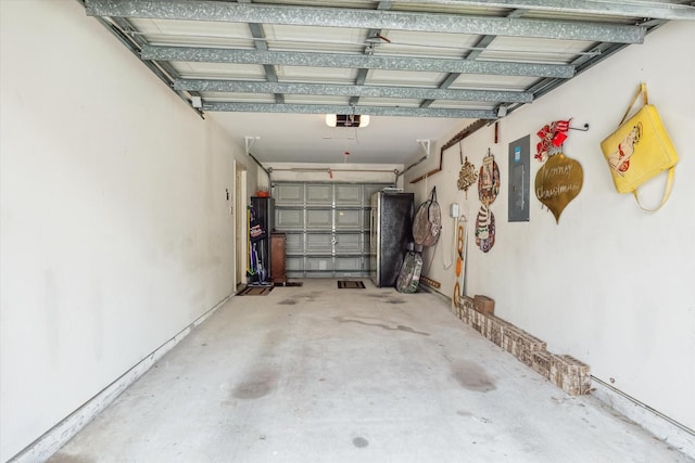 garage featuring electric panel and a garage door opener