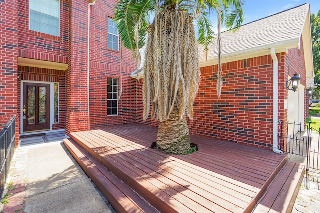 wooden deck featuring french doors