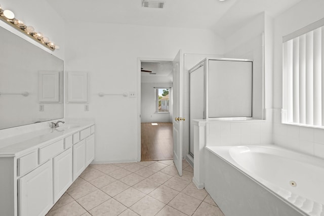 full bathroom featuring a shower stall, visible vents, a whirlpool tub, vanity, and tile patterned flooring
