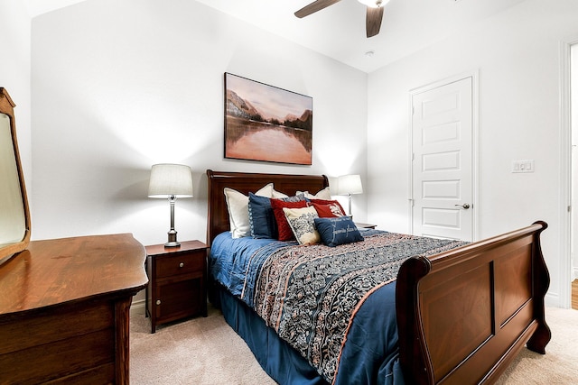 bedroom featuring light carpet and ceiling fan