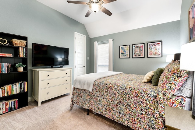carpeted bedroom with lofted ceiling and a ceiling fan