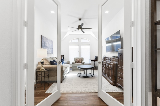 living room with recessed lighting, ceiling fan, vaulted ceiling, and wood finished floors