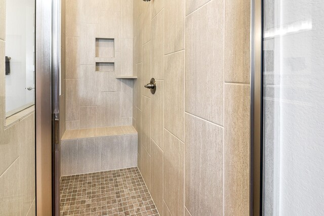 full bath featuring a shower stall