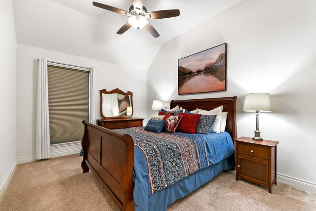 bedroom featuring lofted ceiling, ceiling fan, carpet floors, and baseboards
