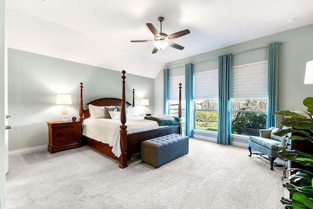 carpeted bedroom featuring baseboards, ceiling fan, and lofted ceiling