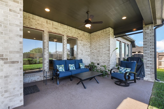 view of patio / terrace with an outdoor hangout area, a ceiling fan, and fence