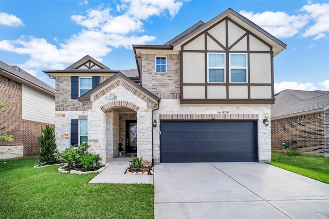 21443 Petherton Dr, Tomball, TX 77375 - view of front of property featuring an attached garage, a front yard, stone siding, and concrete driveway