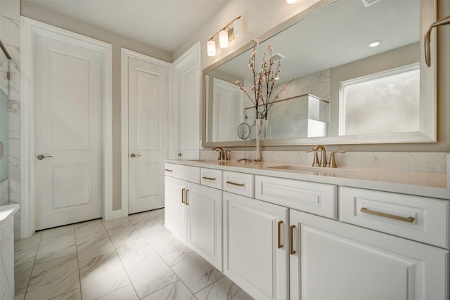 21443 Petherton Dr, Tomball, TX 77375 - bathroom with double vanity, a sink, marble finish floor, and tiled shower