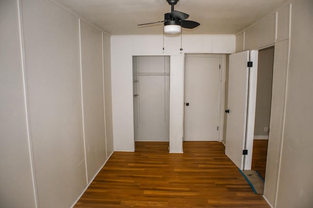 interior space featuring wood finished floors and ceiling fan